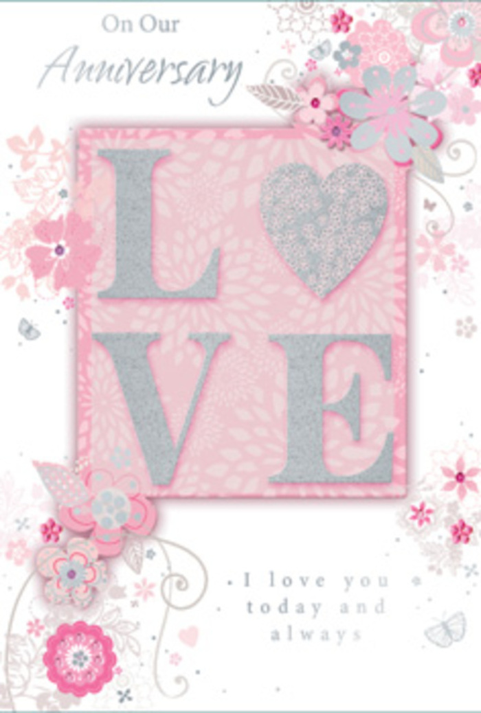 The anniversary card in the scene has a quietly luxurious appearance, echoing the tastefully romantic style of floral gifts often sent around Isleworth for special milestones. At the heart of the design lies the word LOVE, each letter embossed so it stands slightly above the surface of the card. The raised letters are edged with fine, shimmering glitter in silvery white, adding a soft radiance whenever the light touches them, reminiscent of the way petals glisten after rain in the gardens near Syon Park. This central word is set against a deeper blush-pink rectangle, giving it a gentle frame and drawing the eye toward the core sentiment. From this focal point, delicate swirls of stylised flowers and foliage reach outwards across a paler pink background. The blossoms are rendered in subtle tones of blush, ivory, and muted grey, with meticulous line work suggesting a florist's quick yet confident sketch before arranging real stems into a bouquet. Some petals and leaves are lightly traced with silver, creating tiny glimmers that add another layer of interest without overwhelming the design. The floral pattern flows in graceful arcs, evoking the curve of stems and the soft cascade of blooms in an anniversary arrangement delivered to homes along London Road or near Isleworth train station. An inscription in refined script appears alongside or beneath the main motif, offering loving anniversary sentiments that match the gentleness of the artwork. Altogether, the card projects a feeling of tenderness and enduring affection, like a keepsake to accompany a fragrant bouquet, honouring a relationship that has grown and blossomed over time.